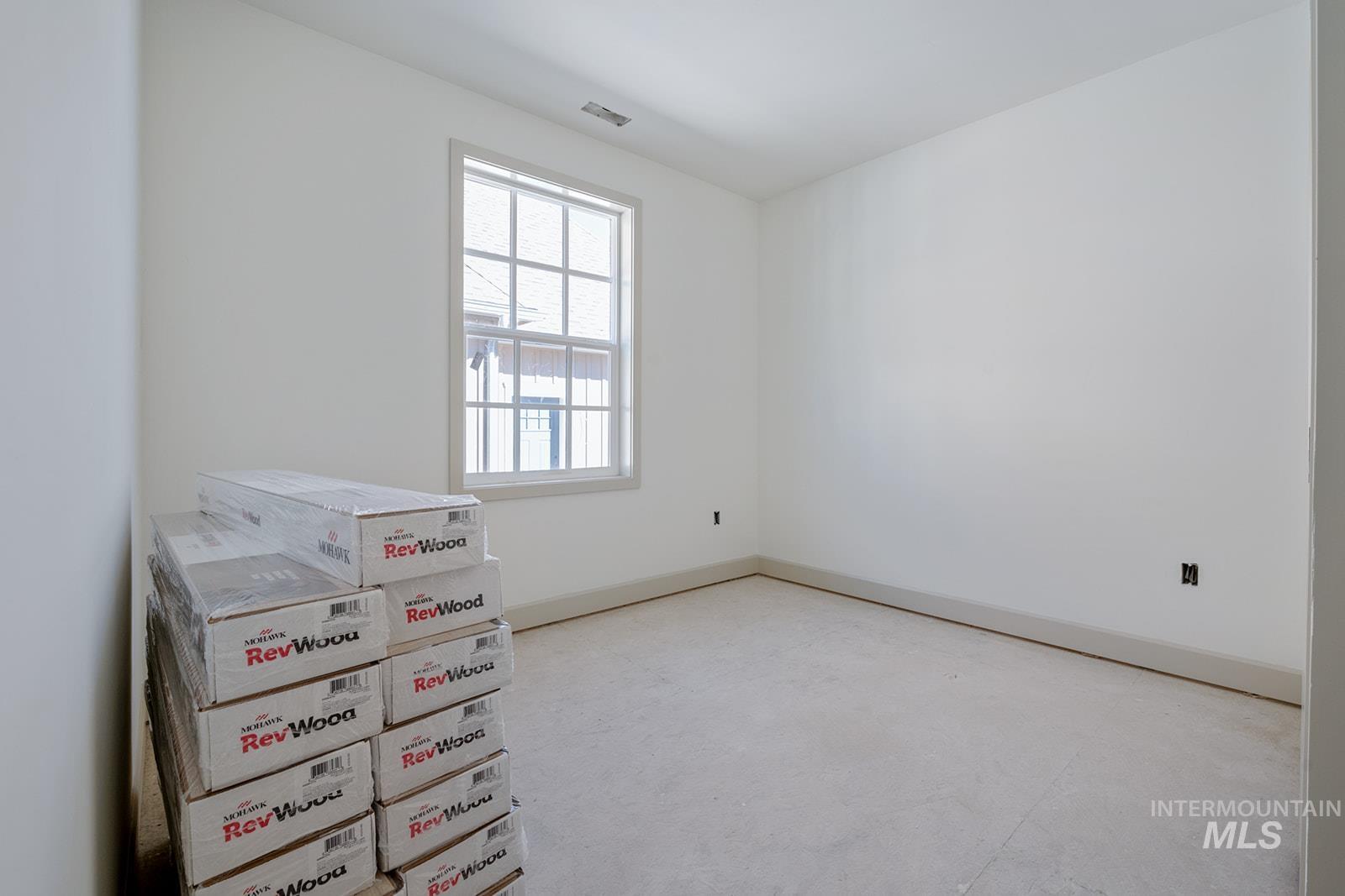1452 Picotee Circle, Unit ROSE Moscow, ID 83843 - Photo 10 of 19 Unfurnished bedroom with baseboards and concrete flooring