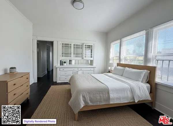 a bedroom with a bed and a dresser