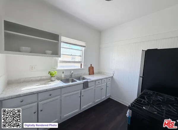 a kitchen with a sink and cabinets