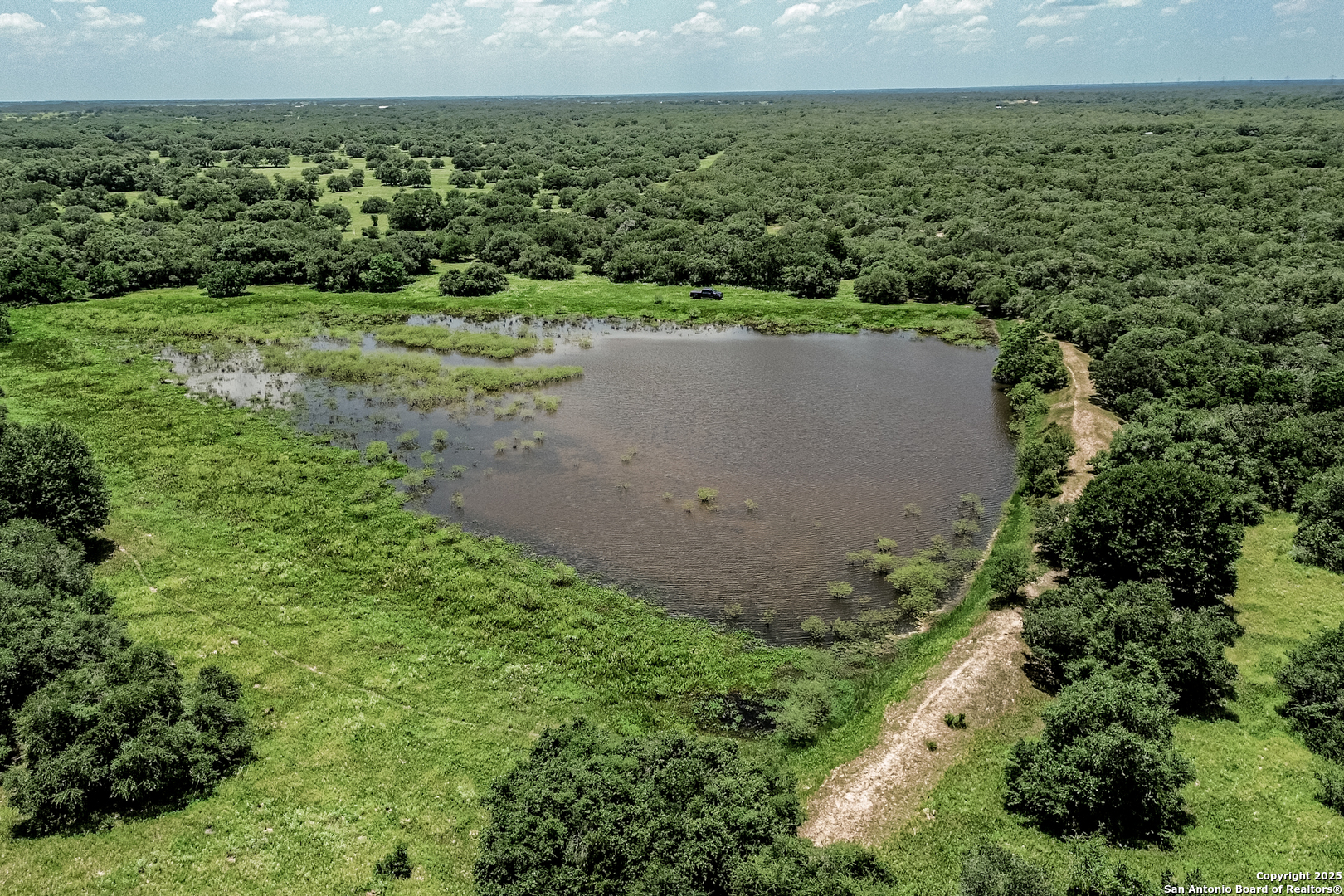 Tbd Fm 682 Yoakum, TX 77995 - Photo 44 of 68 an aerial view of a house with a yard and lake view