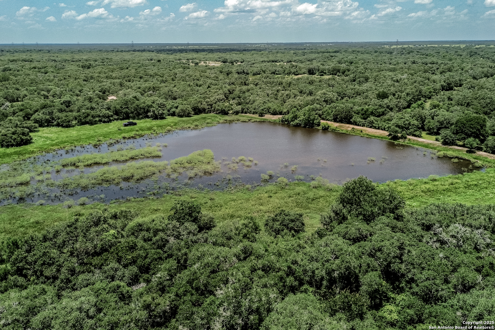 Tbd Fm 682 Yoakum, TX 77995 - Photo 6 of 68 a view of a lake with a city