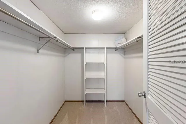 a view of an empty walk in closet