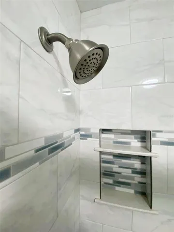 a kitchen with granite countertop a sink and cabinets
