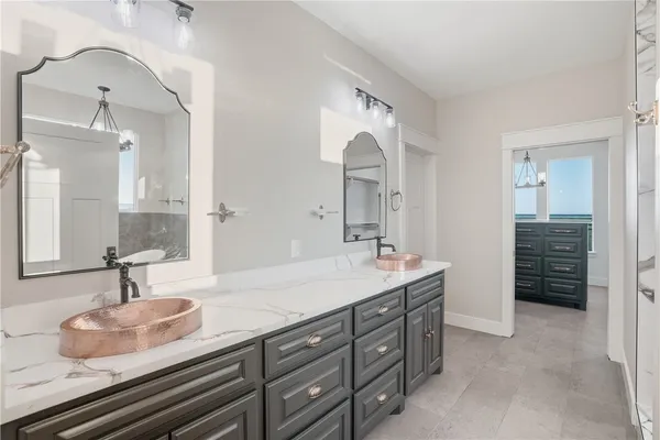 a bathroom with a sink vanity and a mirror