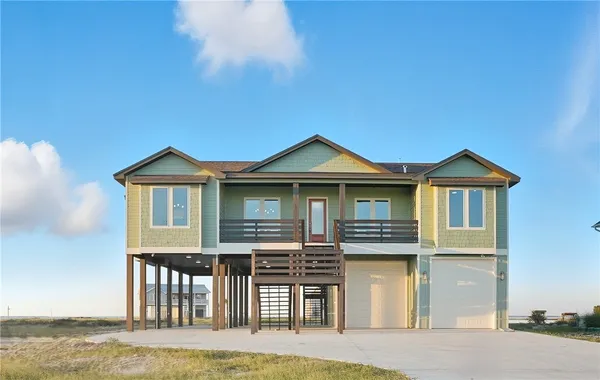 a front view of a house with yard