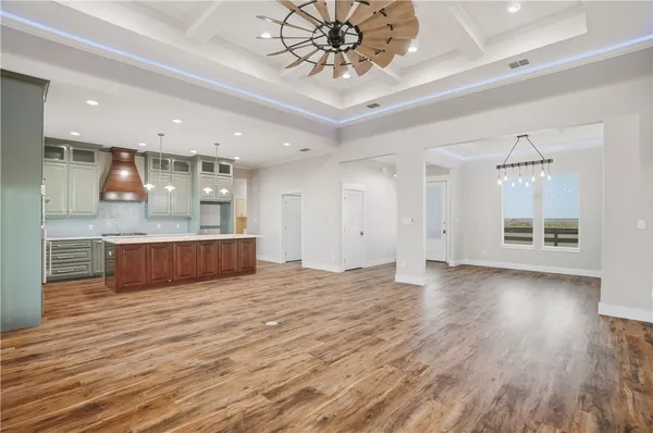 a view of kitchen with sink and wooden floor