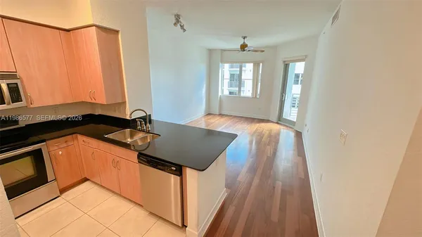 a utility room with sink washer and dryer