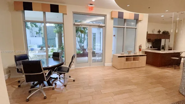 a room with wooden floor and furniture