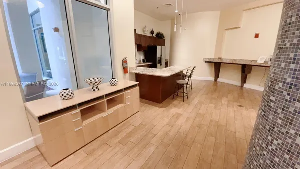 a kitchen with a sink appliances and cabinets