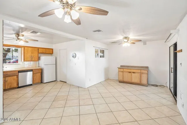 a view of a room with furniture and chandelier fan