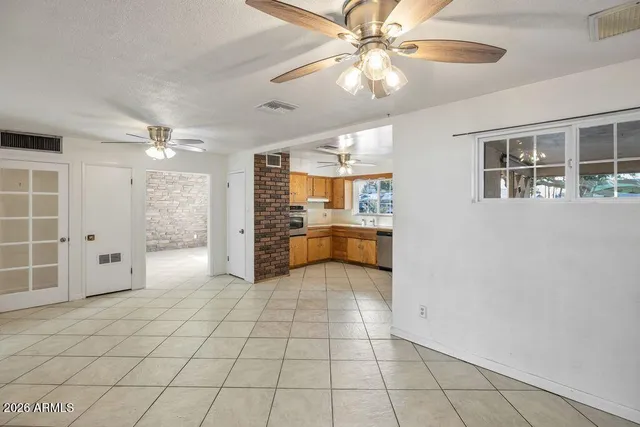 a view of a kitchen with a sink and cabinets