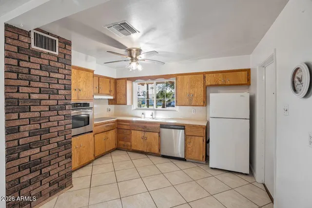 a view of an entryway with a chandelier fan
