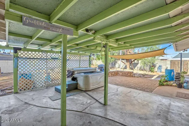 a view of a patio with table and chairs