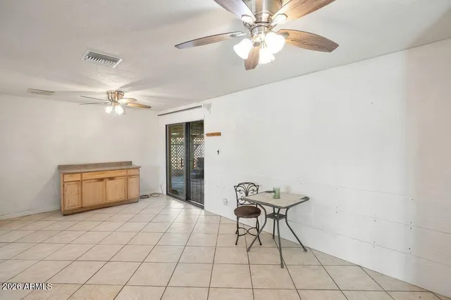 a view of empty room with windows