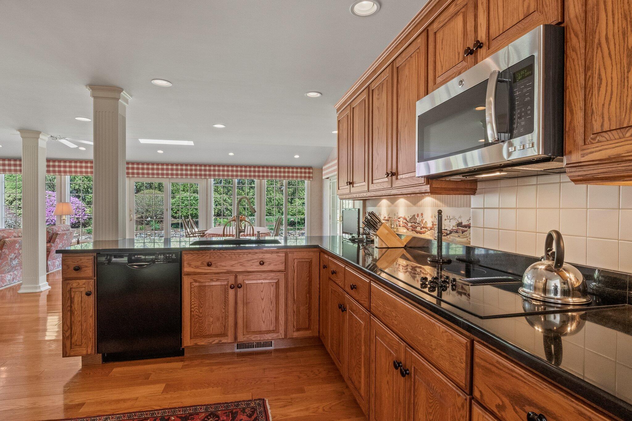 137 Strong Island Road Chatham, MA 02633 - Photo 13 of 37 a kitchen with stainless steel appliances granite countertop a sink stove and cabinets