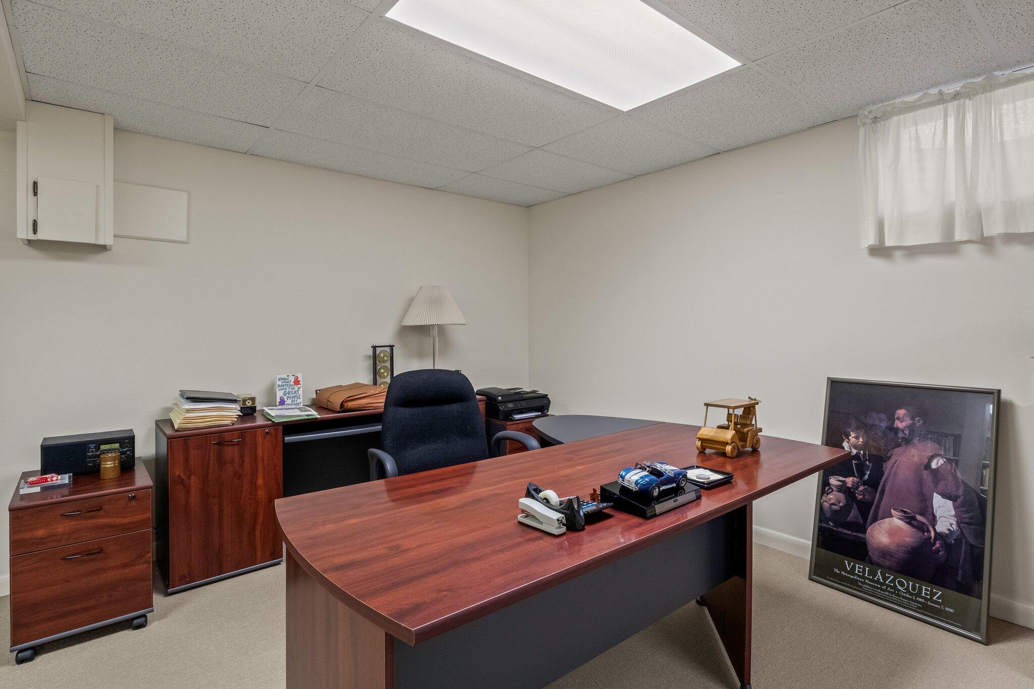 137 Strong Island Road Chatham, MA 02633 - Photo 29 of 37 a bedroom with a bed and a chandelier