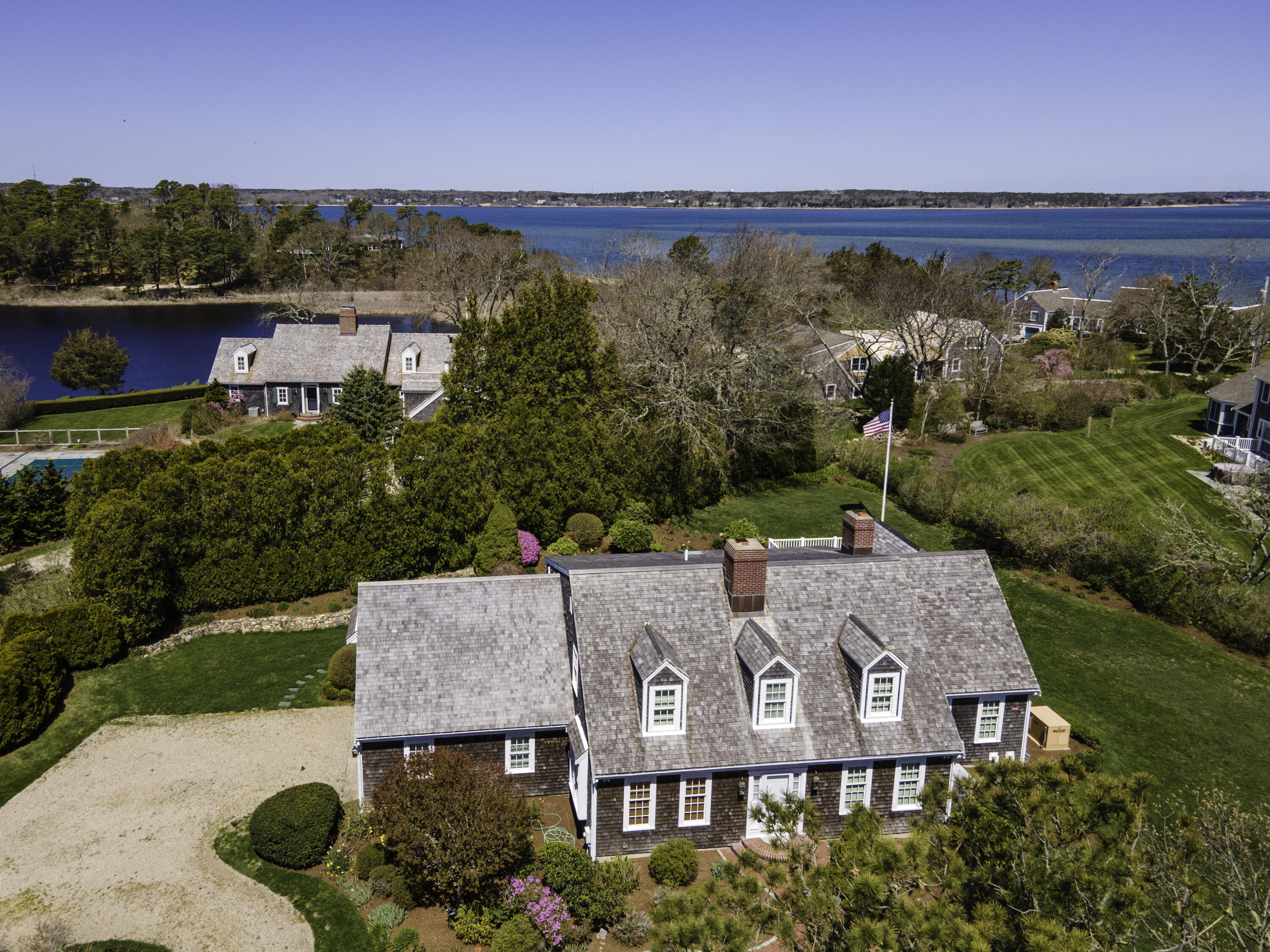 137 Strong Island Road Chatham, MA 02633 - Photo 34 of 37 an aerial view of a house with a garden and lake view