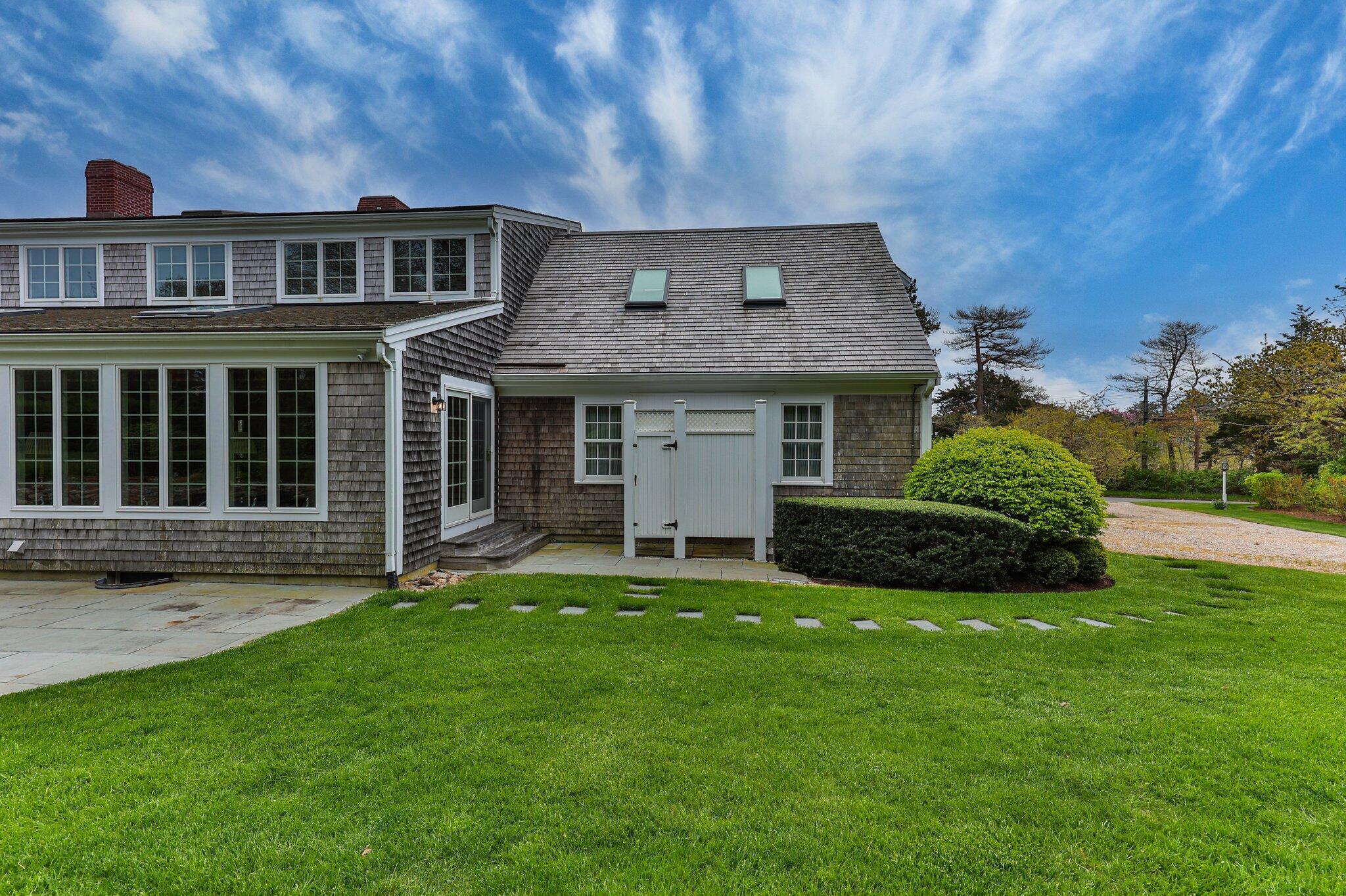 137 Strong Island Road Chatham, MA 02633 - Photo 37 of 37 a front view of a house with a garden and yard