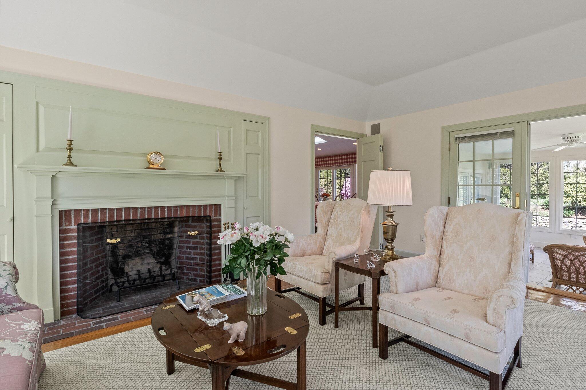 137 Strong Island Road Chatham, MA 02633 - Photo 8 of 37 a living room with furniture and a fireplace