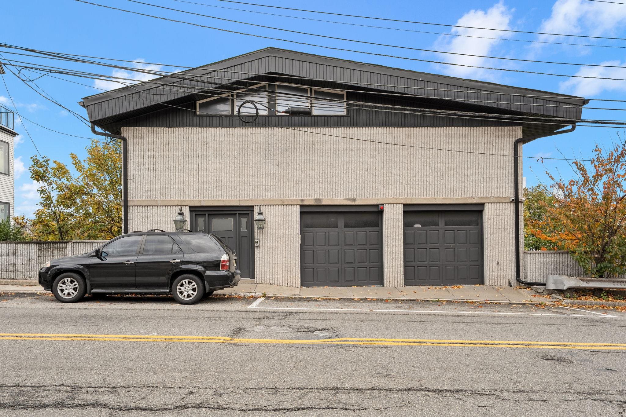 76 Hackensack Plank Road Weehawken, NJ 07086 - Photo 13 of 44 a car parked in front of a house