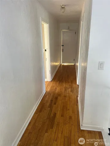 a spacious bathroom with a tub sink and mirror