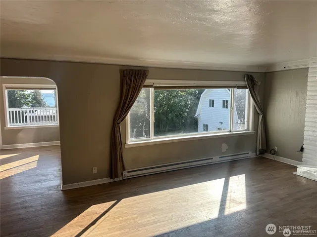a view of an empty room with glass windows