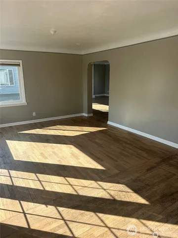 a bedroom with a bed and mirror