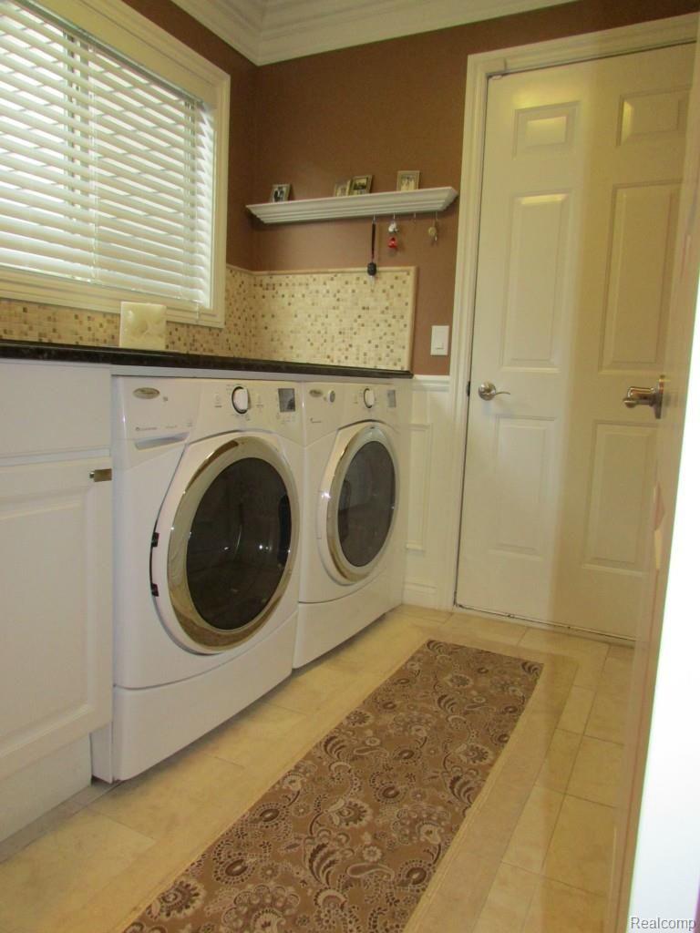 3052 St Clair Drive Rochester, MI 48309 - Photo 16 of 34 Laundry with Granite Counter Top, Stone Tile Back Splash and Ceramic Flooring