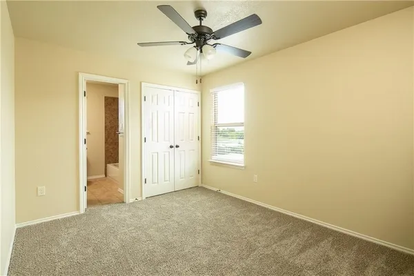 a view of a livingroom with a chandelier fan