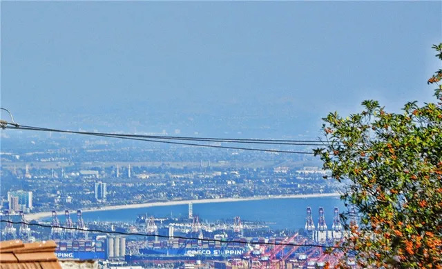 an aerial view of residential houses with outdoor space and swimming pool