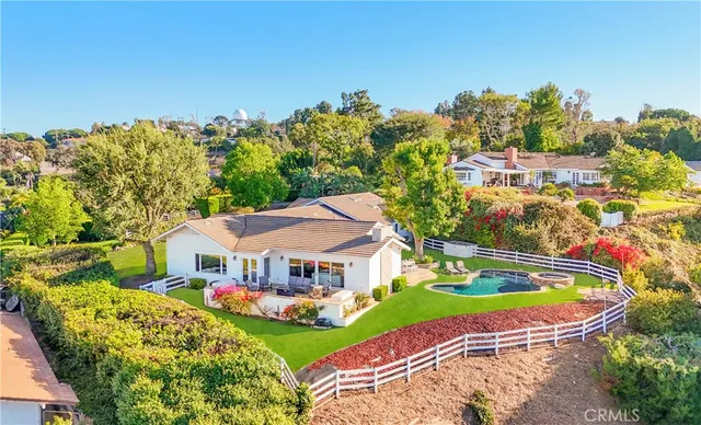 a view of a swimming pool with a yard