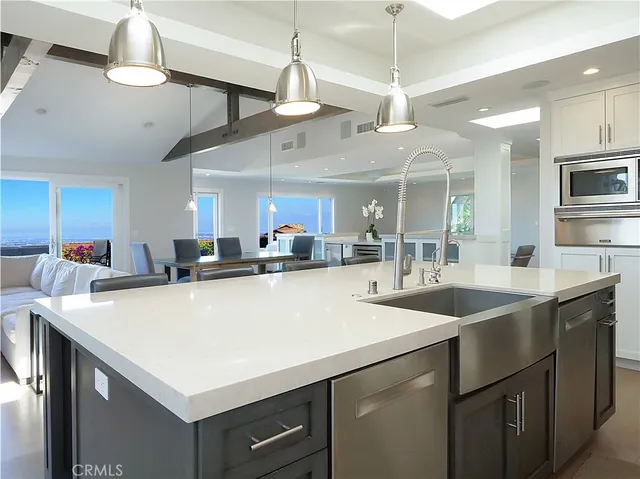 a view of a swimming pool with a garden and deck