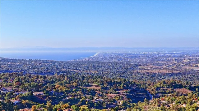 a bedroom with a bed chair and a window