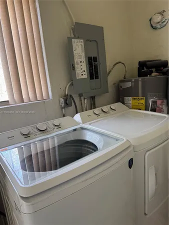 a utility room with dryer and washer