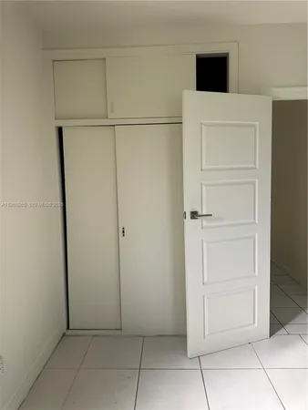 an empty room with cabinet