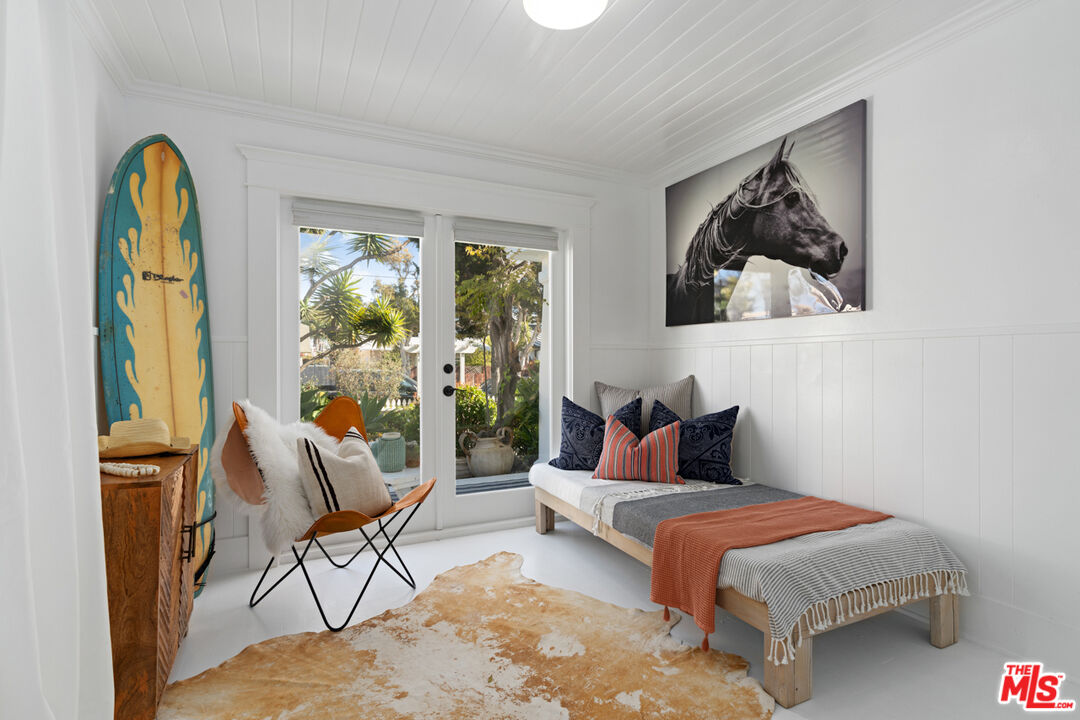 743 Sunset Avenue Venice, CA 90291 - Photo 19 of 29 a bedroom with a bed and glass window