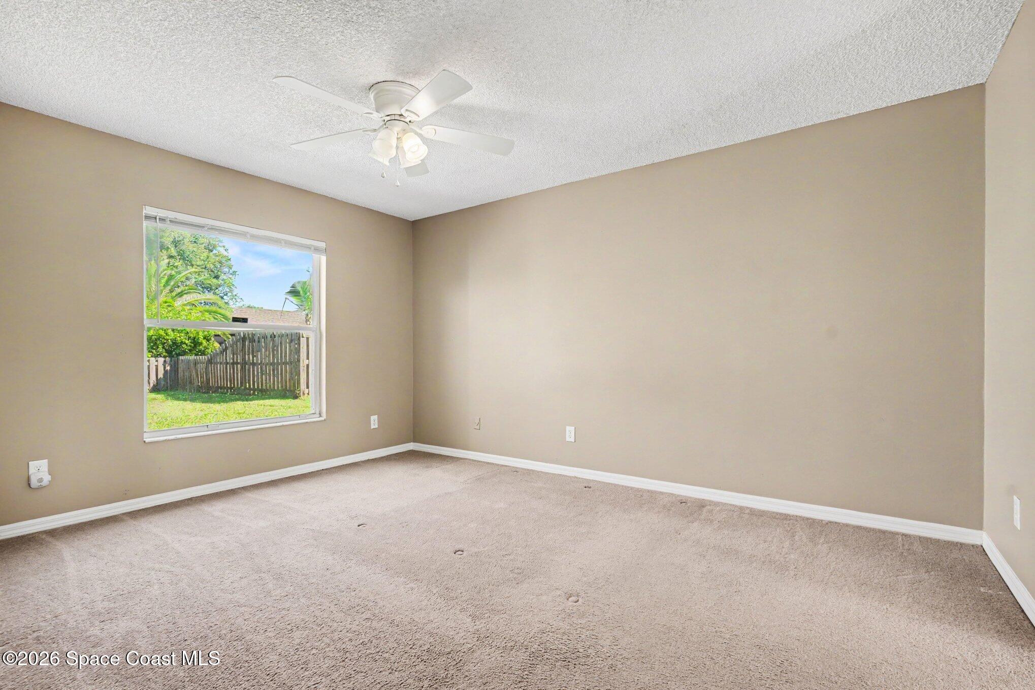 1154 Ida Way Melbourne, FL 32940 - Photo 18 of 27 Primary Bedroom