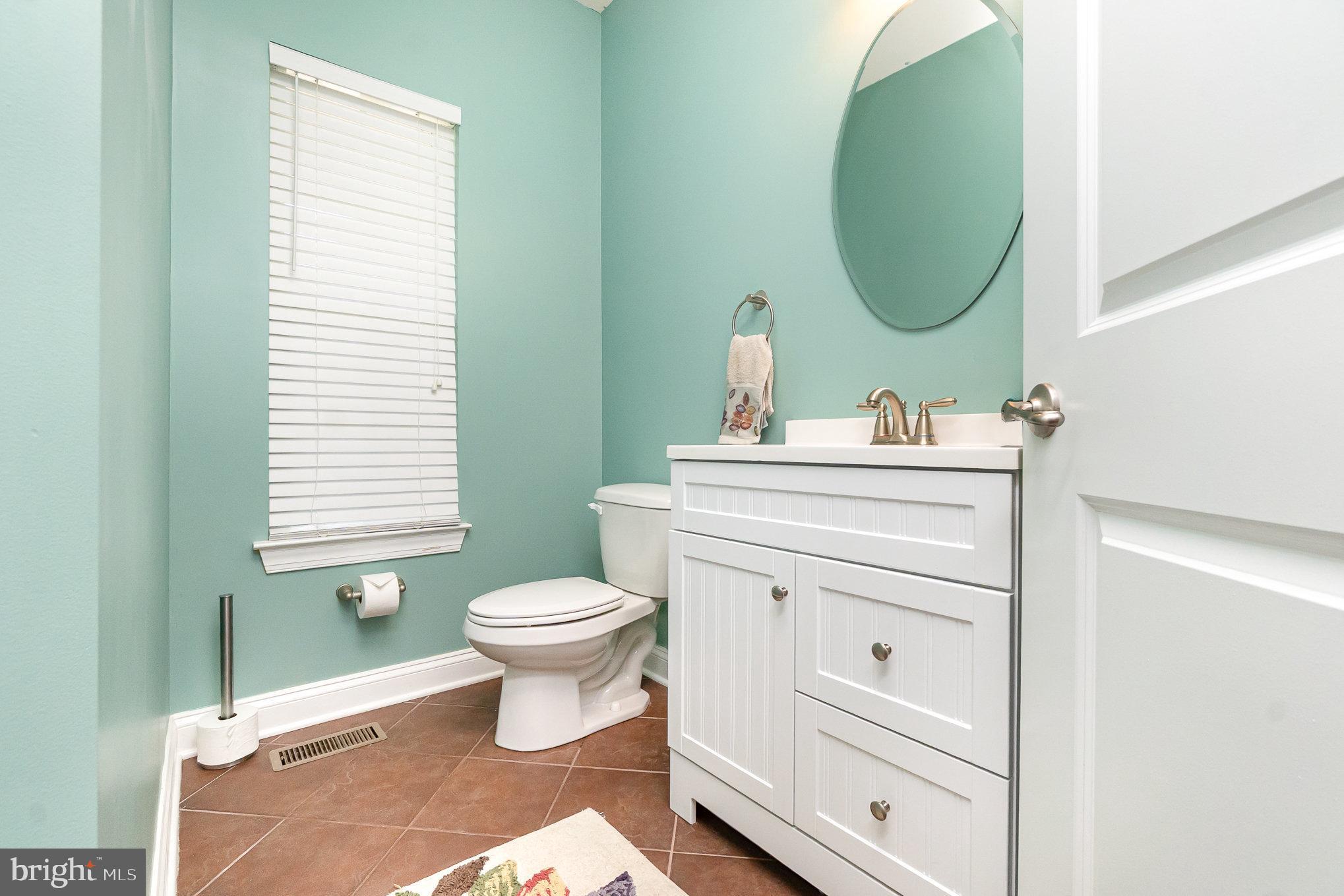 10535 Windlass Run Road Baltimore, MD 21220 - Photo 16 of 42 a bathroom with a sink toilet and a mirror