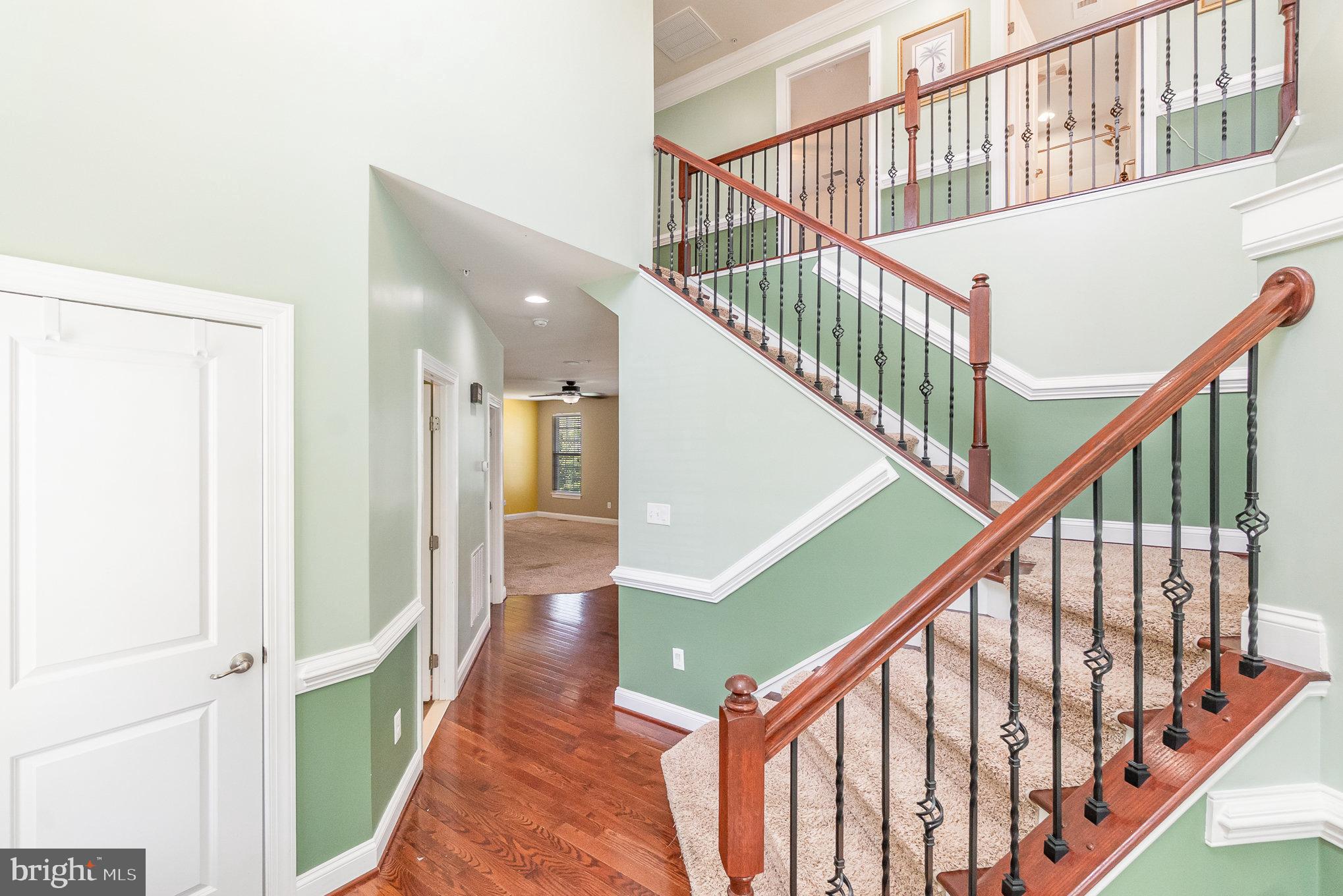 10535 Windlass Run Road Baltimore, MD 21220 - Photo 20 of 42 a view of staircase with wooden floor and white walls