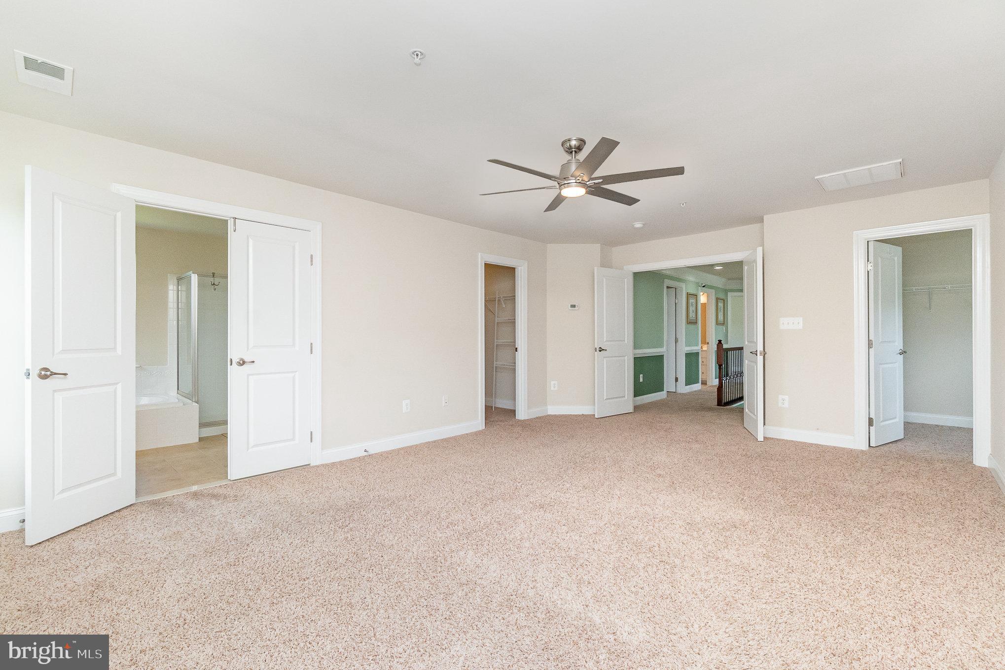 10535 Windlass Run Road Baltimore, MD 21220 - Photo 23 of 42 a view of empty room with closet and ceiling fan