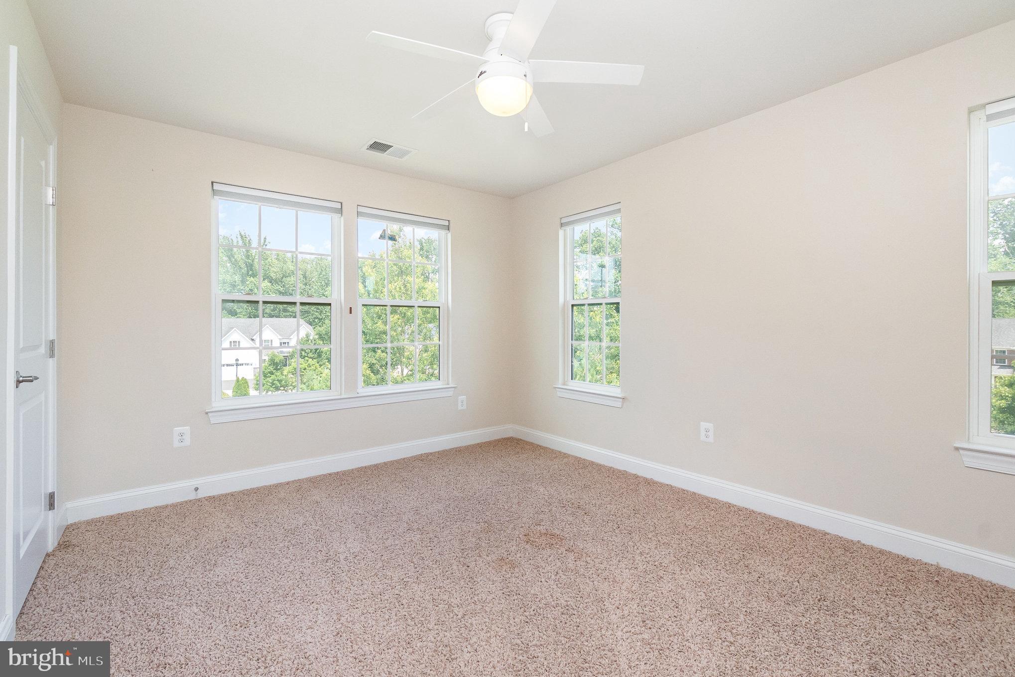 10535 Windlass Run Road Baltimore, MD 21220 - Photo 26 of 42 an empty room with windows and closet