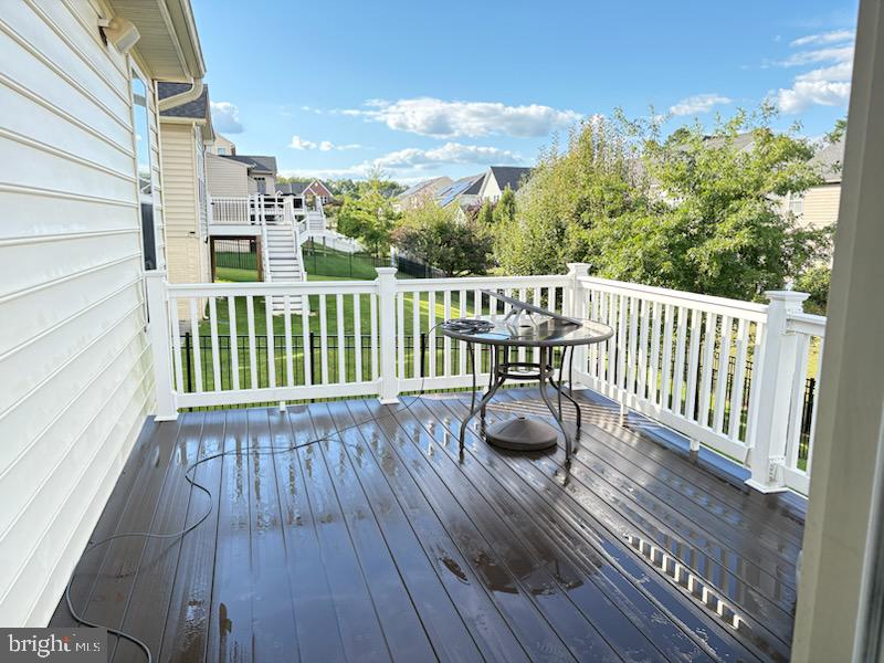 10535 Windlass Run Road Baltimore, MD 21220 - Photo 36 of 42 a view of balcony with wooden floor
