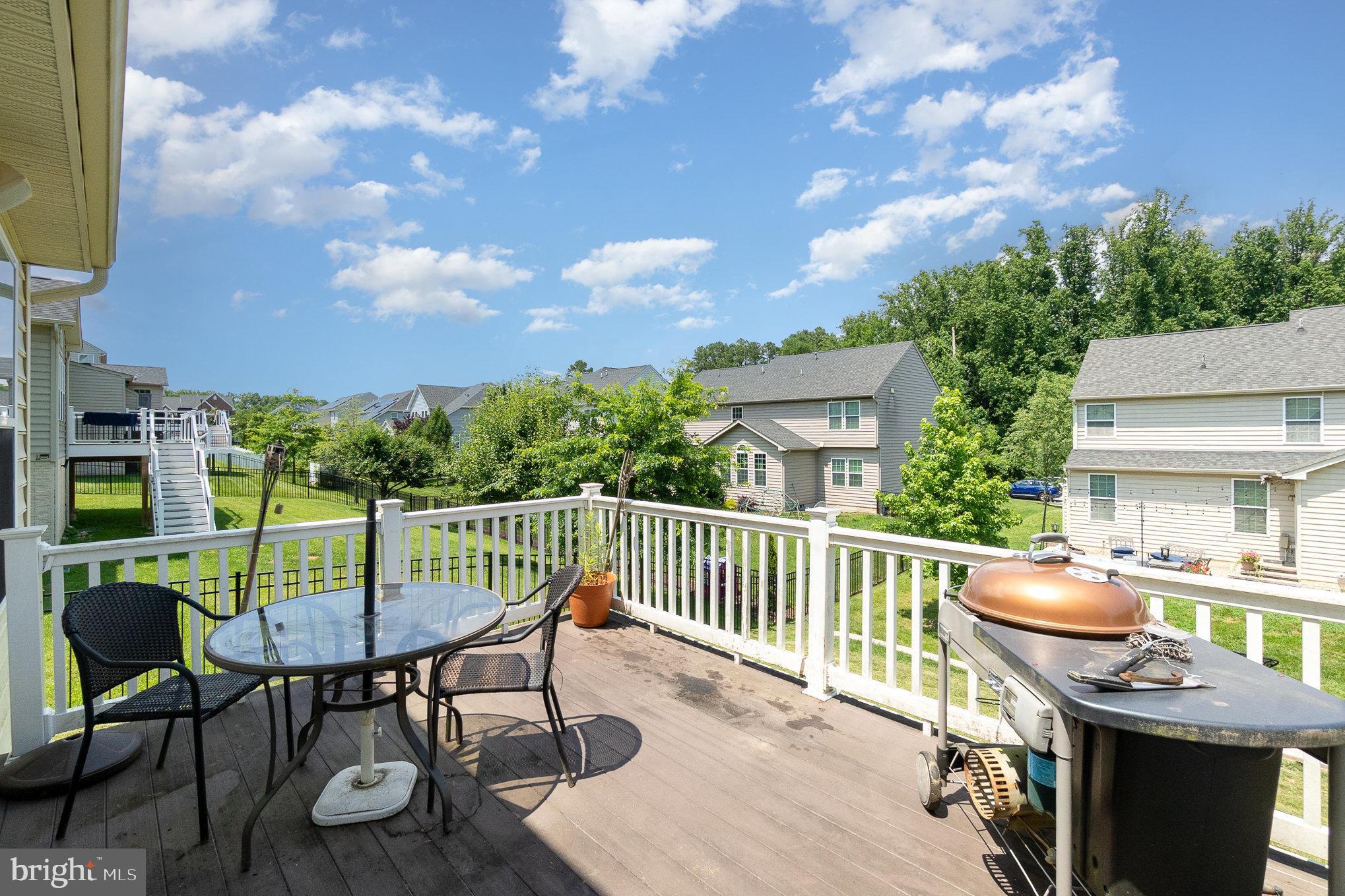 10535 Windlass Run Road Baltimore, MD 21220 - Photo 37 of 42 a view of a patio with table and chairs and wooden floor