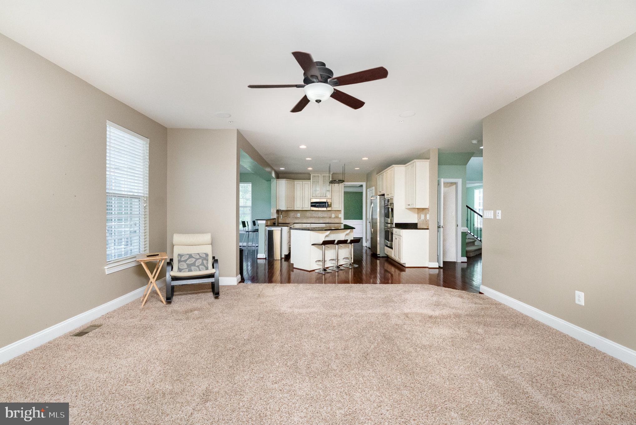 10535 Windlass Run Road Baltimore, MD 21220 - Photo 10 of 42 a view of a livingroom with chairs and a ceiling fan
