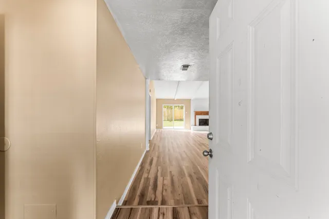 a view of bedroom with wooden floor