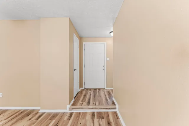 a view of a room with a ceiling fan