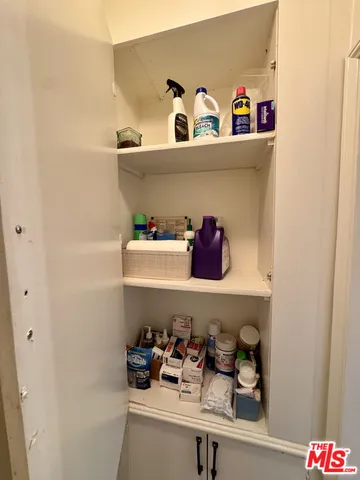 a view of hallway with wooden floor