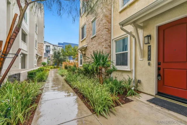 a view of a pathway both side of house