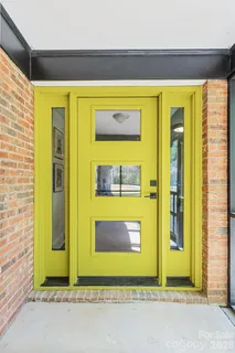 a view of front door with yellow door