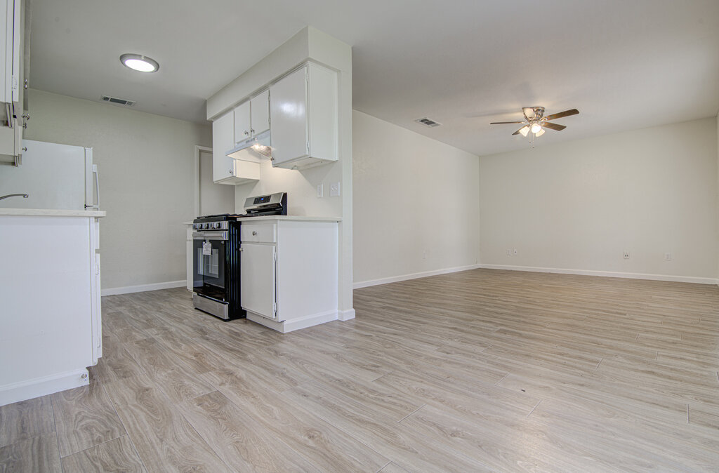 5301 Indio Circle, Unit A Austin, TX 78745 - Photo 25 of 25 An open floorplan seamlessly connects the well-lit kitchen with sleek appliances to a spacious living area.